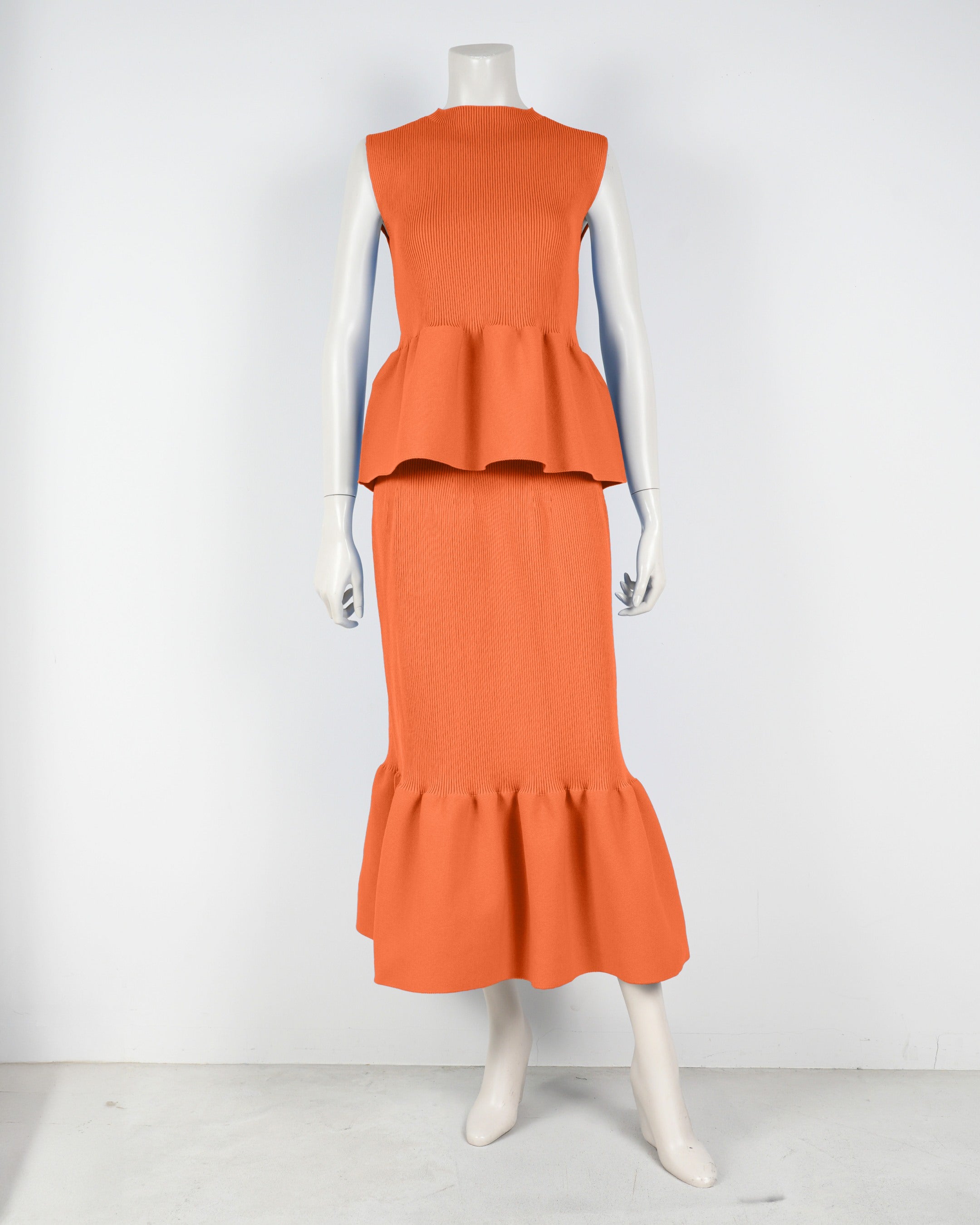 Sleeveless peplum pullover x mermaid skirt