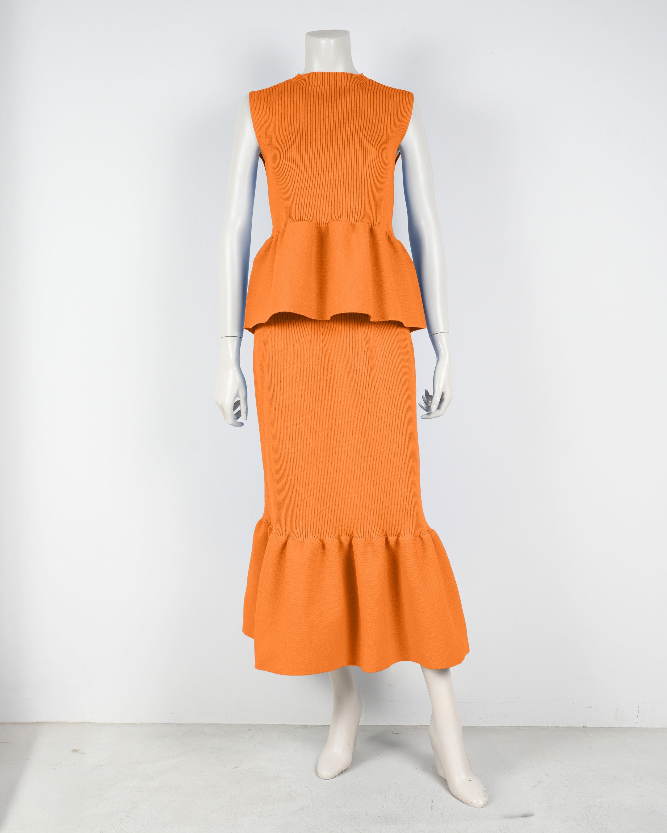 Sleeveless peplum pullover x mermaid skirt