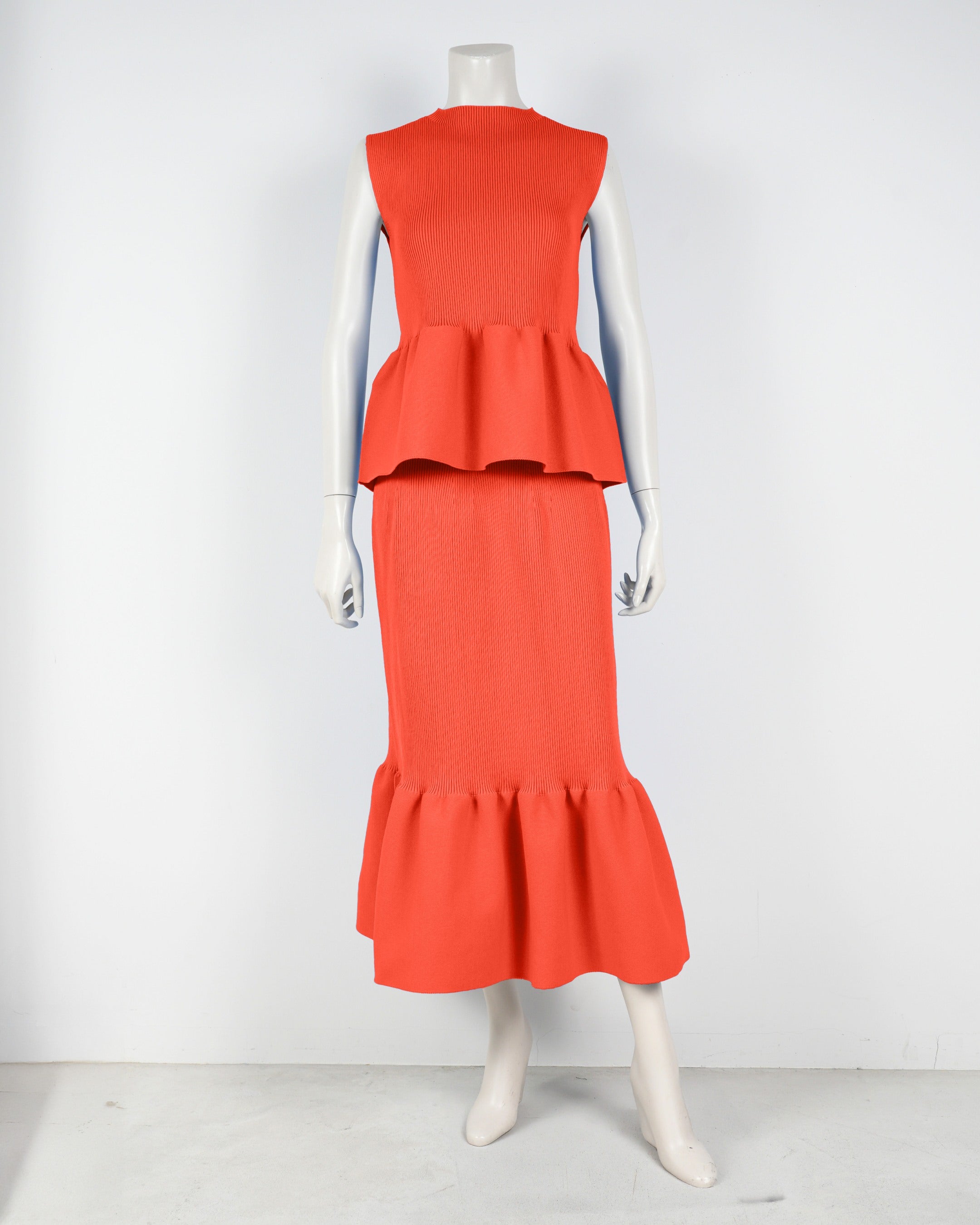 Sleeveless peplum pullover x mermaid skirt
